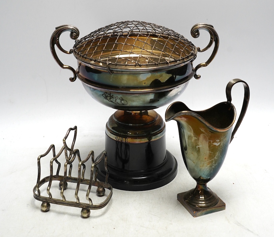 A group of various plated wares to include toast racks, cream jug etc. Condition - fair